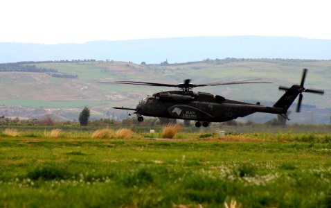 US Navy 040303-N-5821W-006 An MH-53E Sea Dragon assigned to the Black Stallions of Helicopter Combat Support Squadron Four (HC-4) attempts a landing on Naval Air Station Sigonella flight line