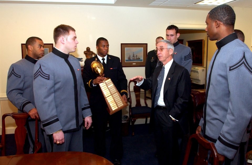 US Navy 040122-N-2568S-002 Cadets from the U.S. Military Academy West Point, and Midshipmen from the U.S. Naval Academy meet with the Secretary of the Navy, the Honorable Gordon R. England during the official presentation of th