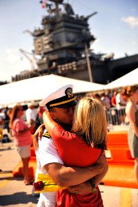 US Navy 110713-N-YR391-164 Lt. Lief Walroth hugs his wife during a homecoming celebration