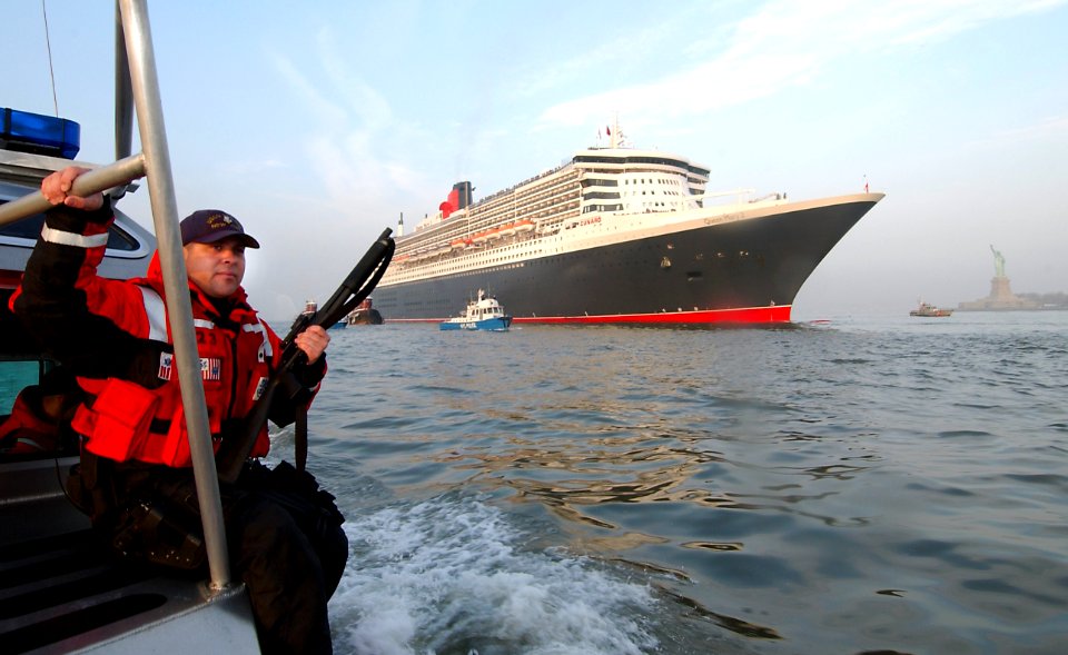 US Navy 040422-G-0000S-001 Coast Guard Machinery Technician 1st Class Simon Sandoval, of Tucumcari, N.M., provides security for Queen Mary II
