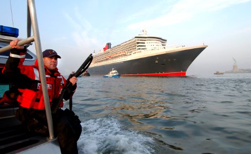 US Navy 040422-G-0000S-001 Coast Guard Machinery Technician 1st Class Simon Sandoval, of Tucumcari, N.M., provides security for Queen Mary II