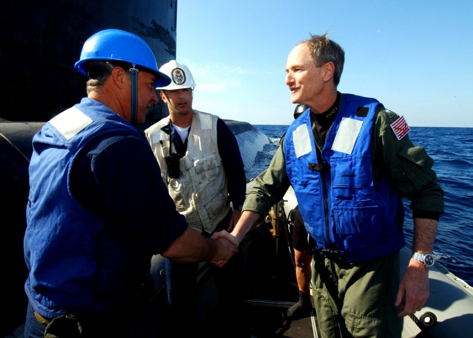 US Navy 040313-N-4374S-007 Rear Adm. Richard Gallagher, Commander, Carrier Group Four, right, greets Sailors assigned to the guided missile destroyer USS Roosevelt (DDG 80)