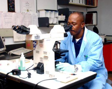 US Navy 040423-N-0000W-033 Hospital Corpsman 2nd Class Dave Hinds checks a specimen in the stat lab of the U.S. Naval Hospital (USNH) Yokosuka Laboratory Department
