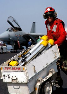 US Navy 040309-N-3986D-095 Aviation Ordnanceman 3rd Class Joseph Little, of Tampa, Fla., moves Bols chaff loaders across the flight deck aboard USS George Washington (CVN 73)