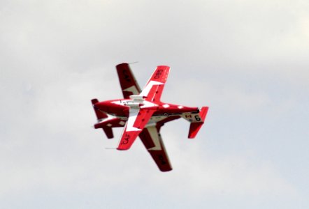 US Navy 040514-N-0295M-012 The lead solo pilot crosses by the opposing solo pilot as the Canadian Forces air demonstration team, the Snowbirds perform