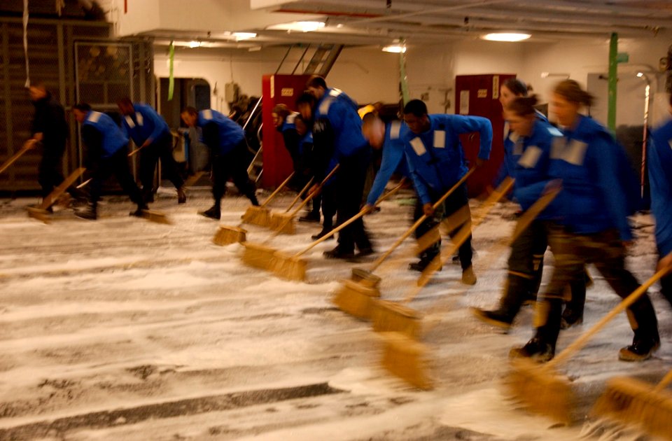 US Navy 040213-N-8774S-034 Sailors scrub down the ship's hangar bay aboard the nuclear powered aircraft carrier USS Harry S. Truman (CVN 75)