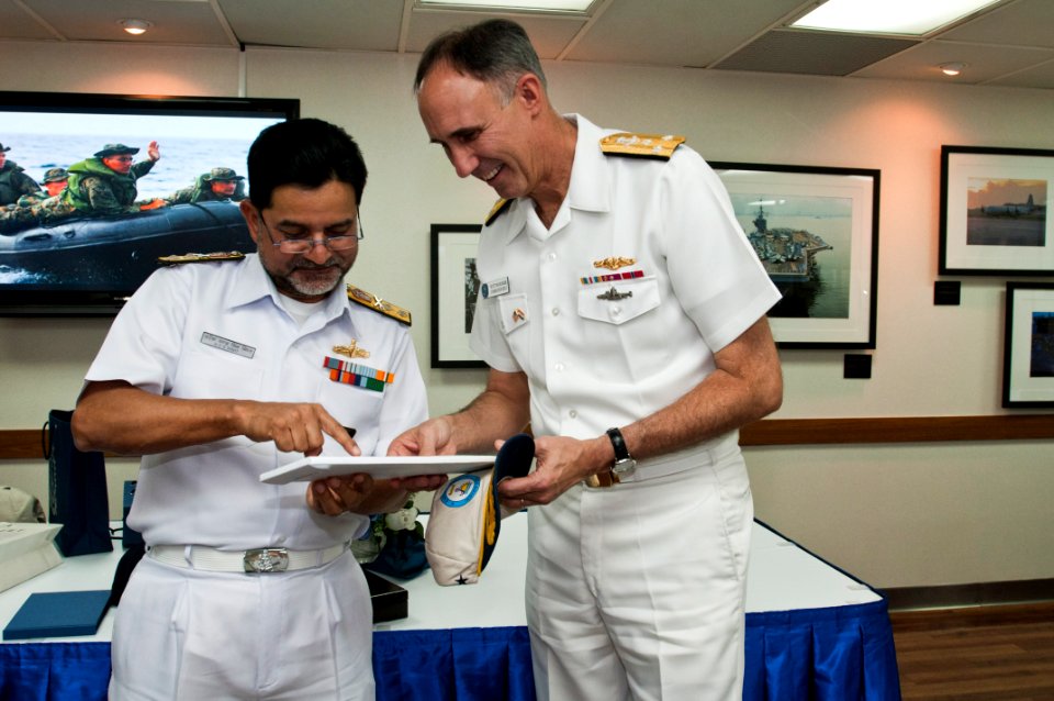 US Navy 110407-N-XXXXX-036 Indian navy Rear Adm. HCS Bisht, flag officer of Commanding Eastern Fleet, presents a gift to Vice Adm. Scott R. Van Bu