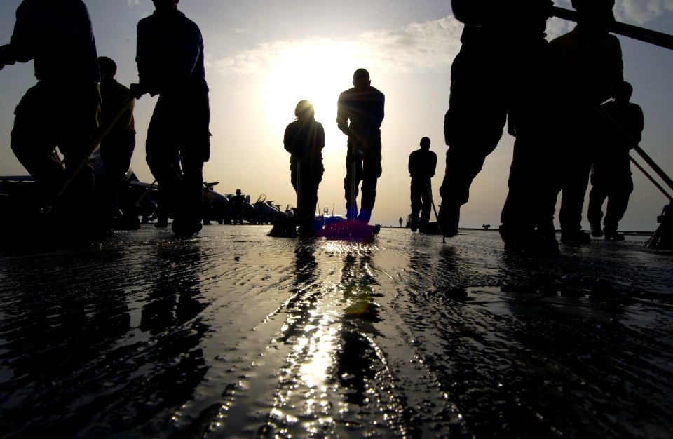 US Navy 040327-N-5319A-002 Sailors assigned to V-1 Division aboard USS George Washington (CVN 73) participate in a Scrub Ex of the flight deck during a no-fly day