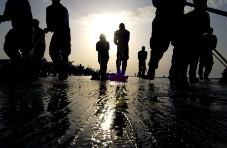 US Navy 040327-N-5319A-002 Sailors assigned to V-1 Division aboard USS George Washington (CVN 73) participate in a Scrub Ex of the flight deck during a no-fly day