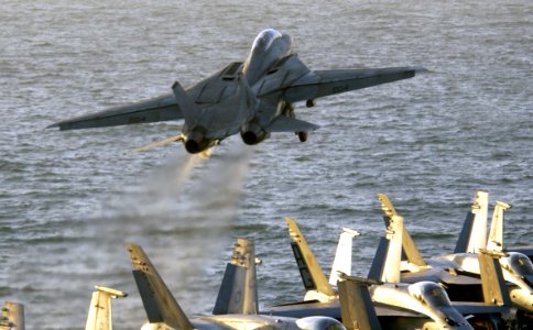 US Navy 040322-N-5319A-002 An F-14B Tomcat assigned to the Red Rippers of Fighter Squadron One One (VF-11) launches off the flight deck of USS George Washington (CVN 73) during evening flight operations
