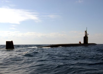 US Navy 040313-N-4374S-002 The Los Angeles-Class attack submarine USS Toledo (SSN 769) surfaces to conduct a small boat transfer using a Rigid Hull Inflatable Boat (RHIB)