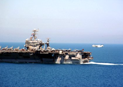 US Navy 040324-N-6278K-133 A C-2A Greyhound assigned to the Rawhides of Carrier Logistics Support Squadron Four Zero (VRC-40) prepares to make an arrested landing on the flight deck aboard USS George Washington (CVN 73)