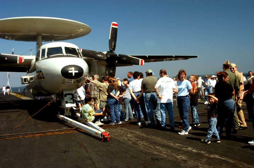 US Navy 040319-N-0000K-105 Excited visitors wait in line for their turn to embark on a tour of an E-2C Hawkeye airborne early warning aircraft aboard the aircraft carrier USS John F. Kennedy (CV 67)