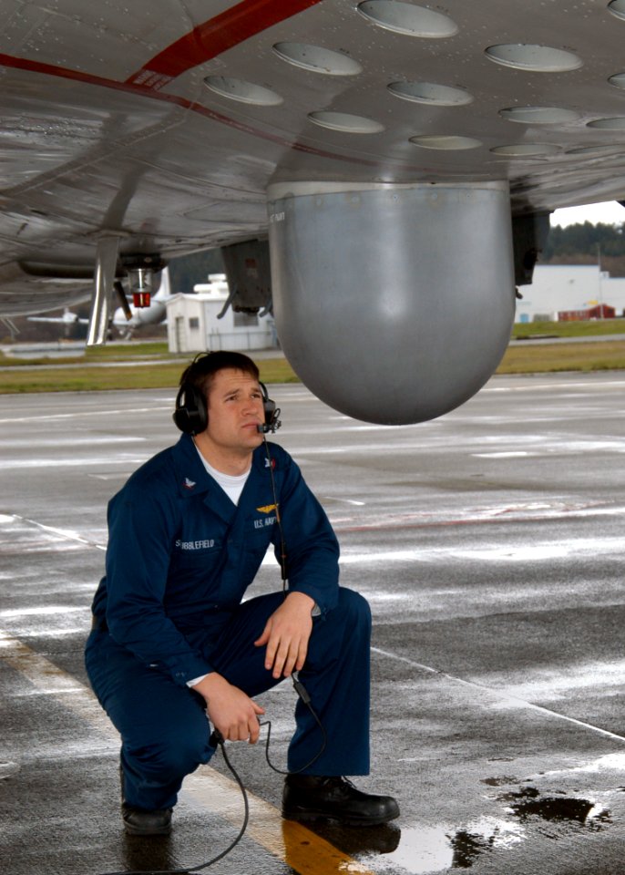 US Navy 040324-N-6247M-002 Aviation Electrician's Mate 3rd Class Josh Stubblefield, from Dallas, Texas, checks the Sonar Buoy tubes of a P-3 Orion assigned to the Grey Knights of Patrol Squadron Forty Six (VP-46) during a pre f