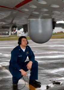 US Navy 040324-N-6247M-002 Aviation Electrician's Mate 3rd Class Josh Stubblefield, from Dallas, Texas, checks the Sonar Buoy tubes of a P-3 Orion assigned to the Grey Knights of Patrol Squadron Forty Six (VP-46) during a pre f