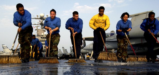 US Navy 040327-N-5319A-001 Sailors assigned to V-1 Division aboard USS George Washington (CVN 73) participate in a Scrub Ex of the flight deck during a no-fly day