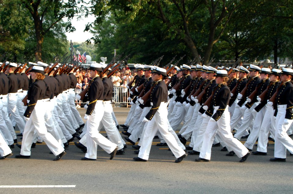 US Navy 040609-A-3085H-065 U.S. Navy Midshipmen from the U.S. Naval Academy march in the precession, in front of the caisson carrying the flag draped casket of former President Ronald Reagan