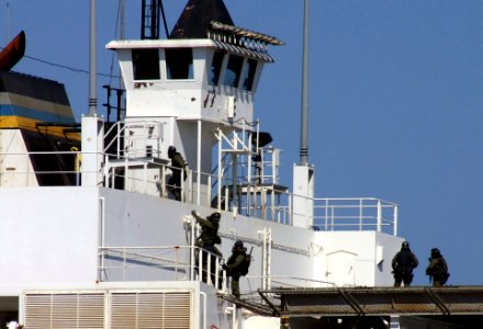 US Navy 040422-N-5821W-009 Italian Special Forces personnel make their way to the bridge of the Military Sealift Command (MSC) maritime prepositioning ship MV PFC Eugene A. Obregon (T-AK 3006)