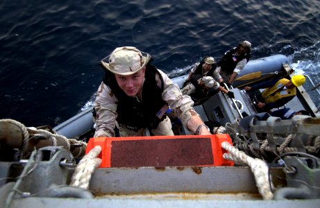 US Navy 040423-N-5319A-014 Hospital Corpsman 3rd Class Adam D. Snook, from Bellingham, Wash., climbs a pilot's ladder as the Visit Board Search and Seizure team (VBSS) assigned to USS Bulkeley (DDG 84)