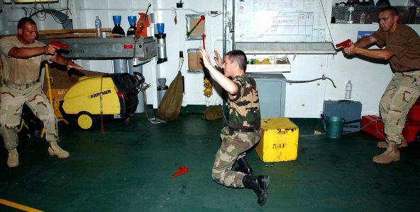 US Navy 040530-C-1034C-045 Members assigned to the U.S. Coast Guard Law Enforcement Detachment Four Zero Three (USCG LEDET- 403), based out of Miami, Fla., teach members of the French, Spanish and Italian Navies basic Law Enfor