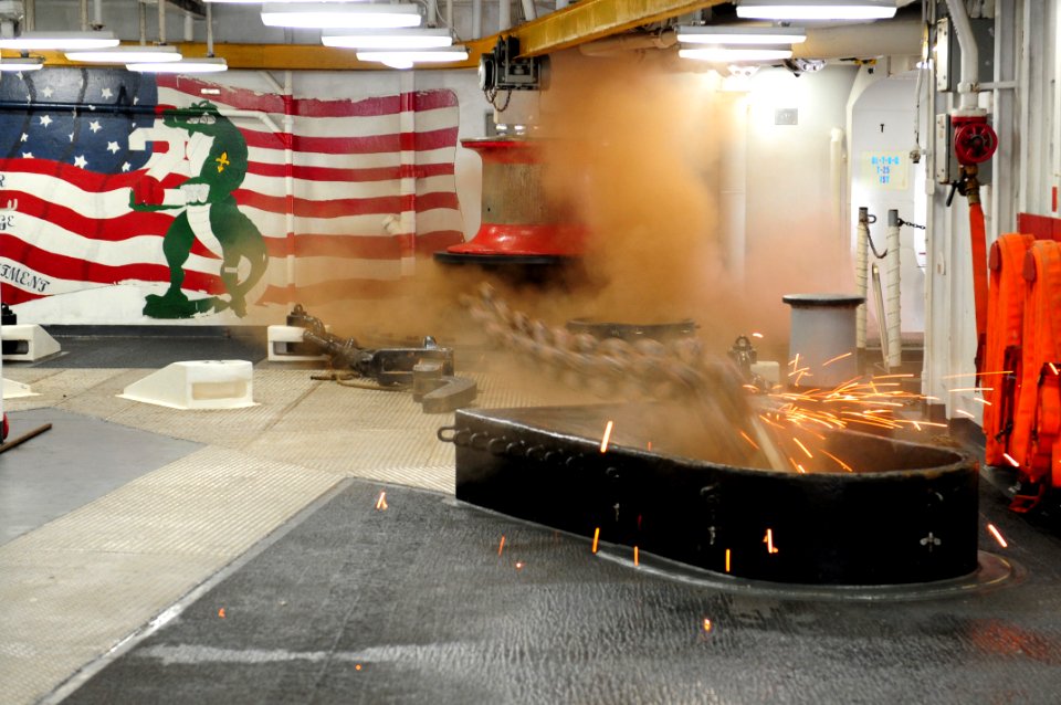 US Navy 111120-N-MW330-114 An anchor chain runs through the hawse pipe aboard the multi-purpose amphibious assault ship USS Essex (LHD 2)