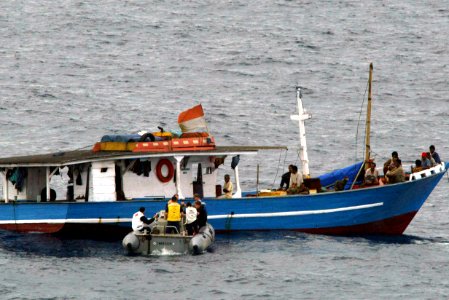 US Navy 040504-N-0000X-001 Crew members assigned to the guided missile cruiser USS Chancellorsville (CG 62) approach the stranded Indonesian fishing vessel Adem Laut
