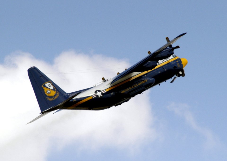 US Navy 040514-N-0295M-039 Fat Albert, a U.S. Marine Corps C-130 Hercules assigned to the U.S. Navy flight demonstration team, the Blue Angels, folds-up its landing gear