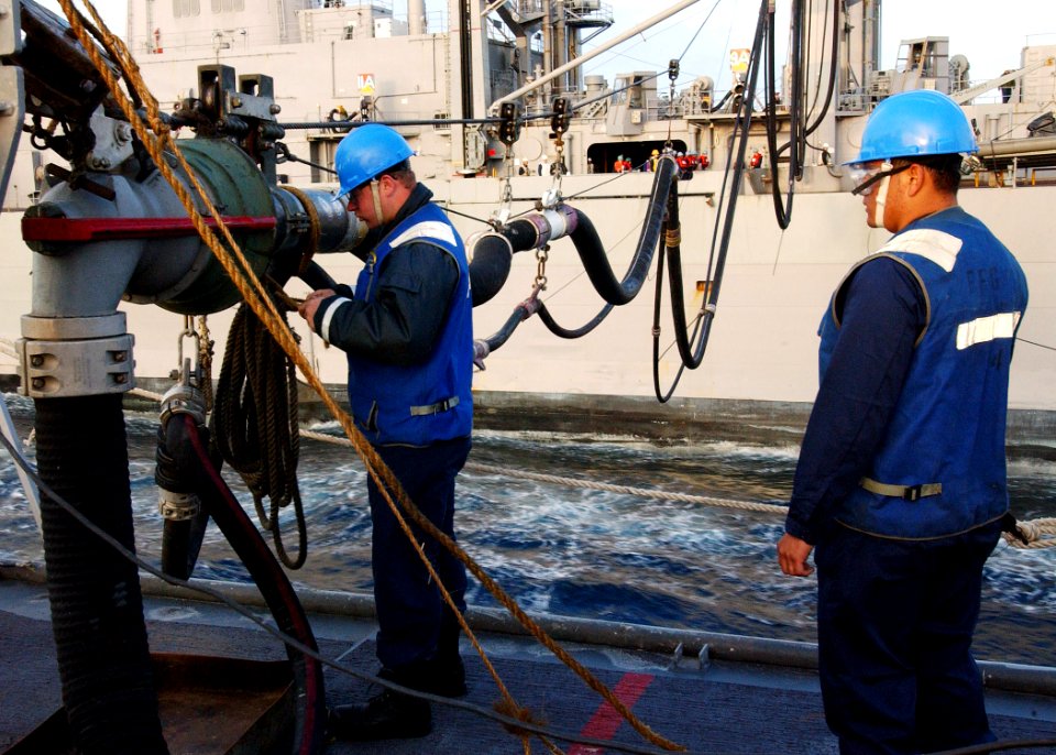 US Navy 040309-N-4374S-006 Sailors assigned to the guided missile frigate USS Taylor (FFG 50) prepare to receive fuel from the fast combat support ship USS Seattle (AOE 3) during a Replenishment at Sea (RAS)