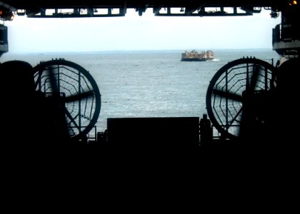 US Navy 040609-N-2972R-011 A Landing Craft, Air Cushion (LCAC) assigned to Assault Craft Unit Four (ACU-4) prepares to depart the well deck of the amphibious assault ship USS Kearsarge (LHD 3) photo