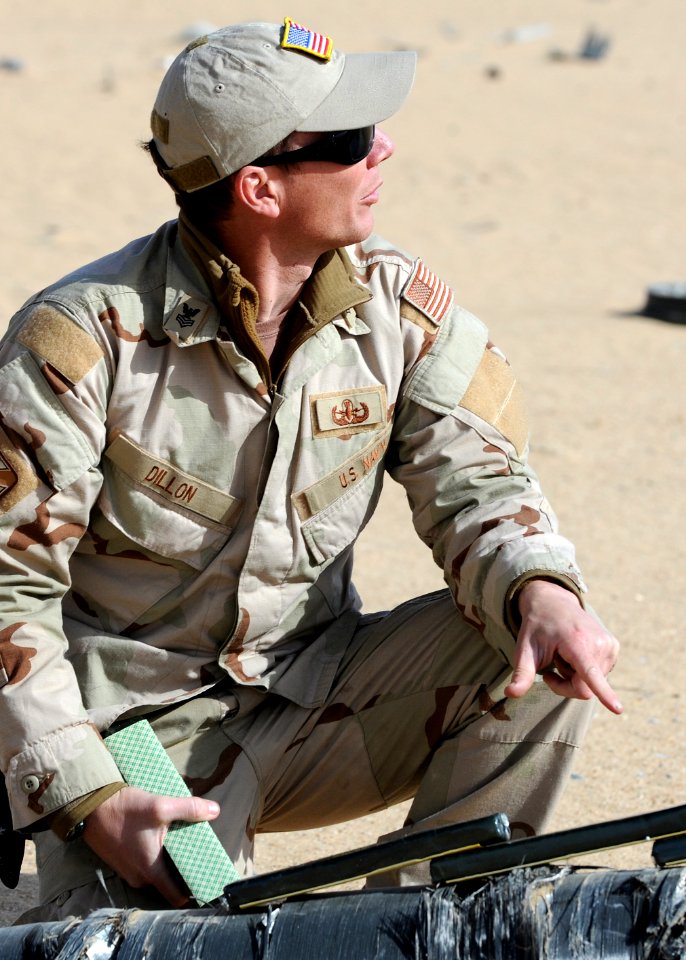 US Navy 111212-N-BA263-362 Explosive Ordnance Disposal Technician 1st Class Mike Dillon, assigned to Commander, Task Group (CTG) 56.1, verifies ins