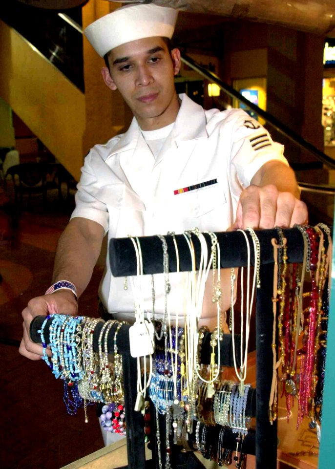 US Navy 040426-N-6268K-019 Seamen Eric Moralez from Houston, Texas, shops for souvenirs at Ft. Lauderdale's beach boardwalk