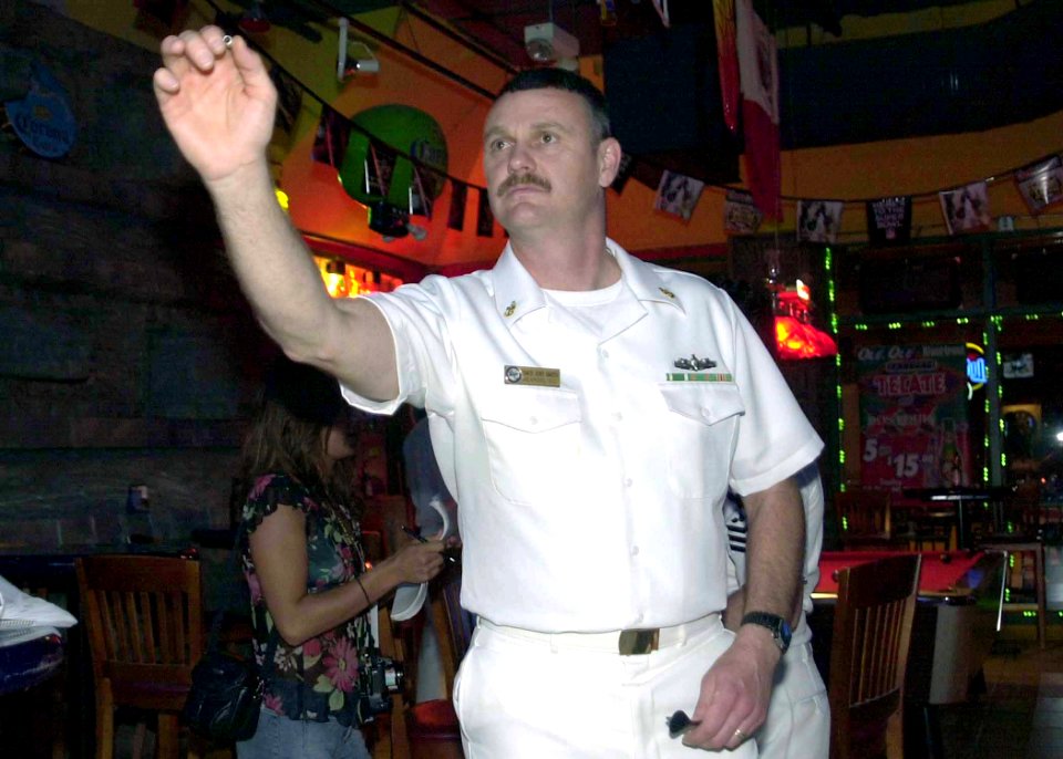US Navy 040426-N-6268K-021 Senior Chief Torpedoman Larry Smith from Brattleboro, Vt., plays darts at Ft. Lauderdale's beach boardwalk