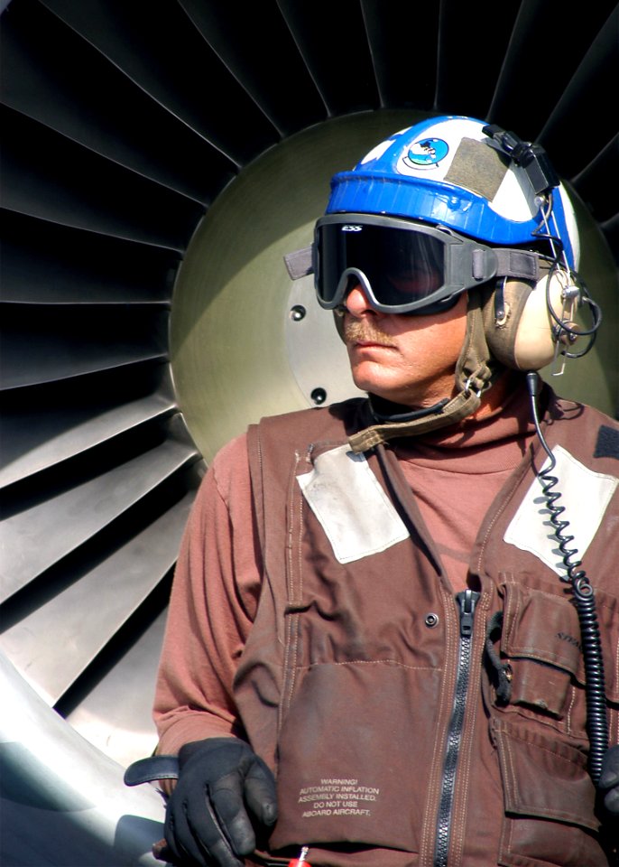 US Navy 040311-N-3986D-066 Chief Aviation Electronics Technician Barry Wheeler, of Houston, Texas, observes flight operations as he stands in front of an S-3B Viking assigned to the Topcats of Sea Control Squadron