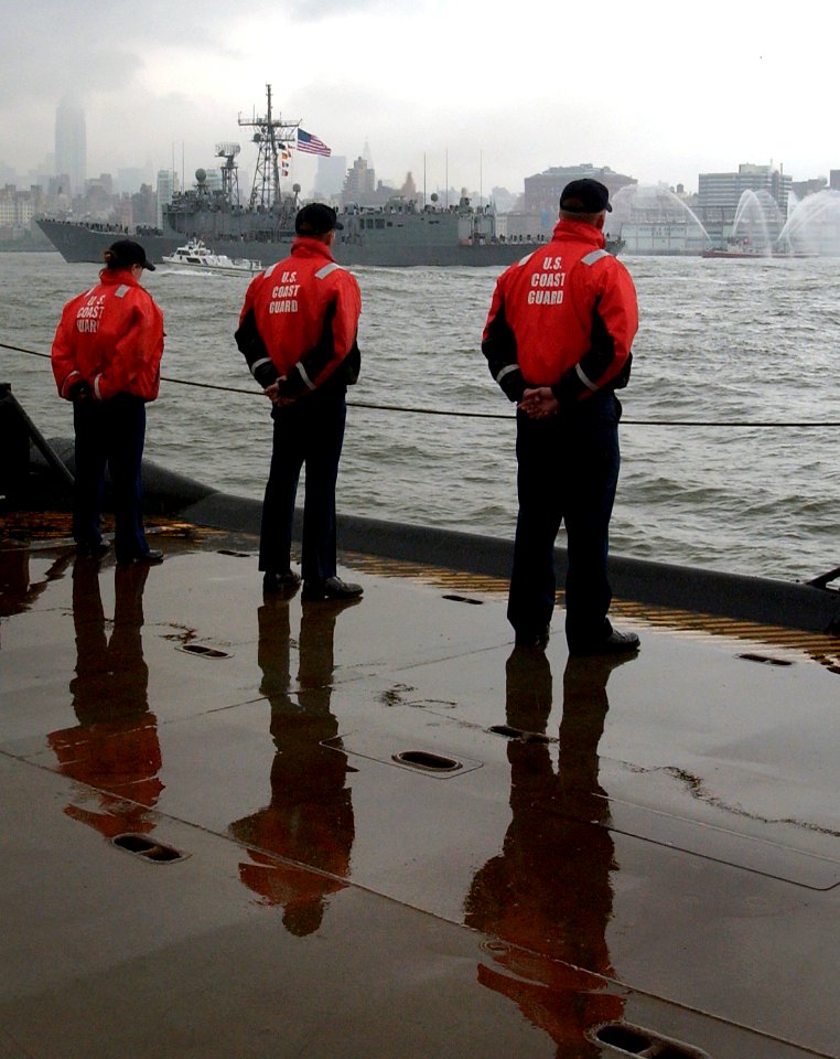 US Navy 040526-C-5313L-080 Crew members assigned to the Keeper-class coastal bouy tender Katherine Walker (WLM 552) render honors to the guided missile frigate USS Robert G. Bradley (FFG 49)