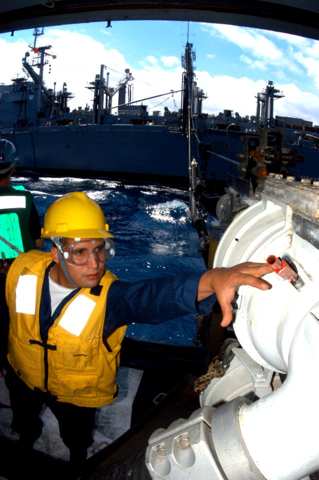 US Navy 040619-N-8704K-008 Boatswain's Mate 2nd Class Tick Rodriquez adjusts the short strap on the double probe fueling station aboard the aircraft carrier USS John F. Kennedy (CV 67)