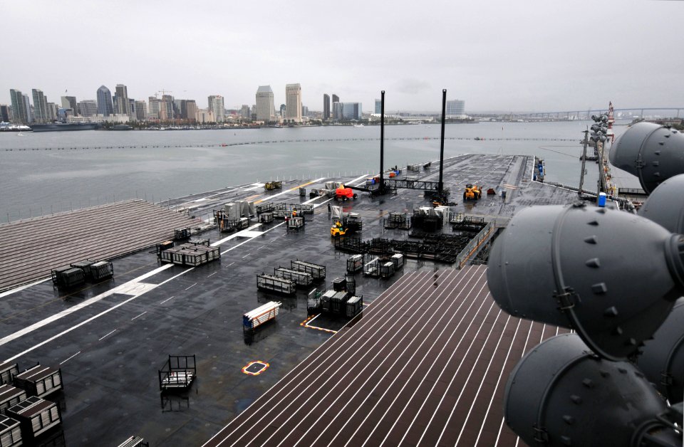 US Navy 111104-N-ZI635-197 Civilian contractors assemble bleachers while constructing a basketball arena aboard Nimitz-class aircraft carrier USS C