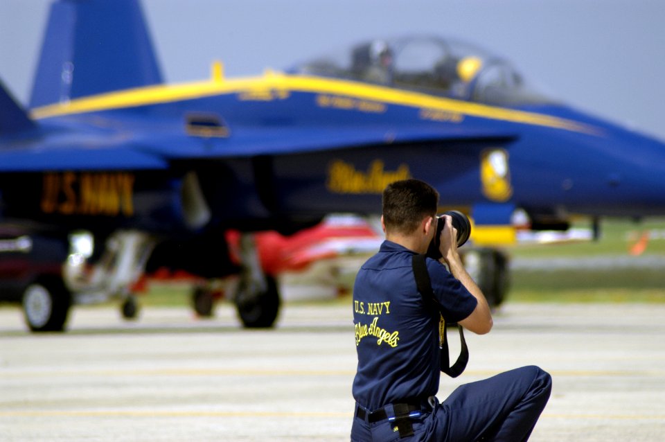 US Navy 040514-N-0295M-045 Draftsman 2nd Class Jeffrey Ballge photographs one of the Blue Angel's six F-A-18A Hornets