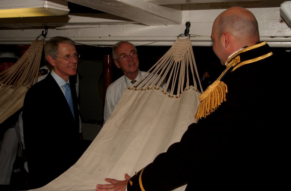 US Navy 040625-N-2568S-004 USS Constitution, Executive Officer, Lt. William Marks describes the sleeping conditions and every-day life aboard the ship during the early 1800's to Secretary of the Navy Gordon R. England