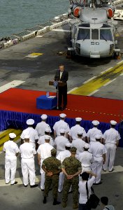 US Navy 040604-F-6655M-162 Sailors and Marines aboard the amphibious assault ship USS Essex (LHD 2) assemble on the ship's flight deck for an address by the U.S. Secretary of Defense Donald Rumsfeld