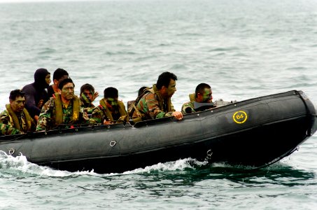 US Navy 040704-N-1464F-006 Peruvian Commandos approach the beach in a zodiac boat during the largest amphibious assault exercise in Latin America in support of UNITAS 45-04