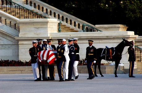 US Navy 040609-A-5968S-051 Ceremonial Honor Guard carry the flag-draped casket of former President Ronald Reagan up the steps of the U.S. Capitol