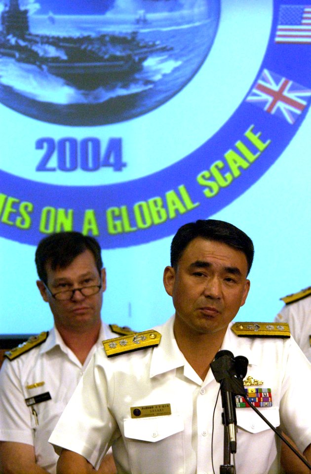US Navy 040629-N-6811L-046 Commander, Escort Flotilla Four, Rear Adm. Takanobu Sasaki, responds to media queries
