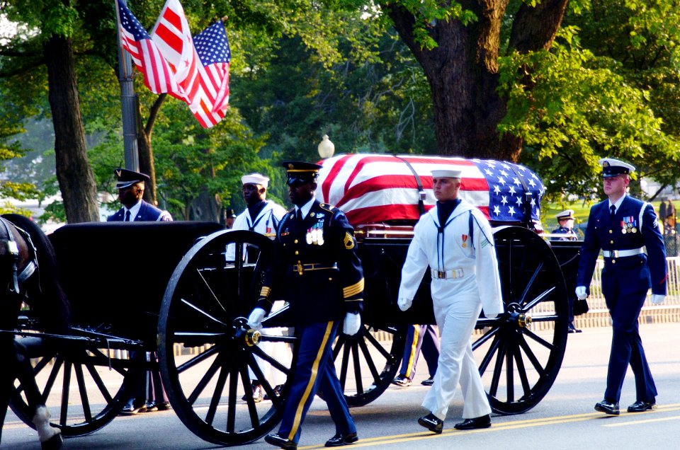 US Navy 040609-N-1464F-010 The Old Guard of the Army's 3rd U.S. Infantry Regiment transports the flag-draped casket of former President Ronald Reagan