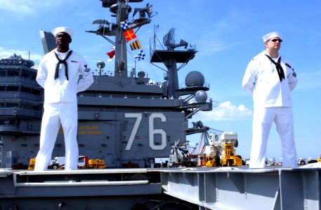 US Navy 040527-N-9319H-022 Sailors aboard USS Ronald Reagan man the rails while preparing to get underway