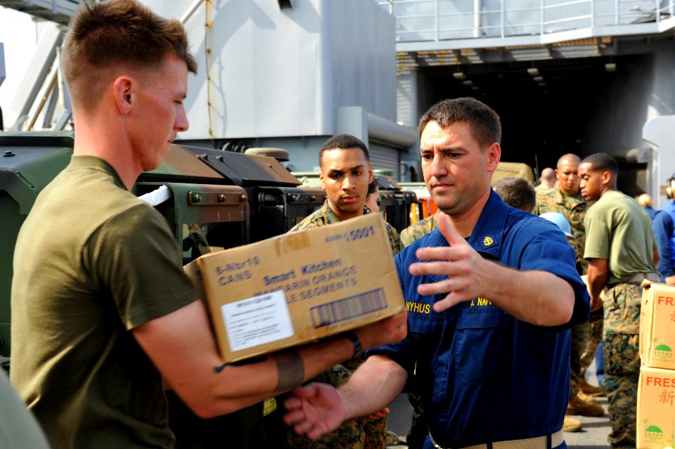 US Navy 111210-N-KS651-629 Sailors and Marines move supplies during a replenishment at sea