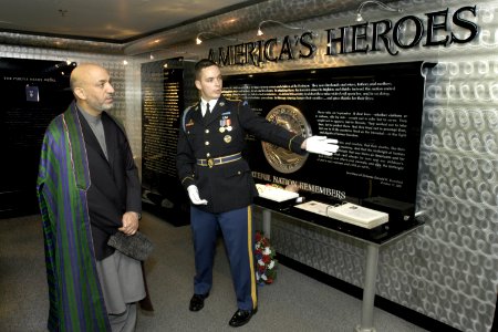 US Navy 040614-D-9880W-109 President of Afghanistan's Transitional Government Hamid Karzai listens as a U.S. Army Honor Guard tell him about the Pentagon memorial and the 184 persons killed in the terrorist attack