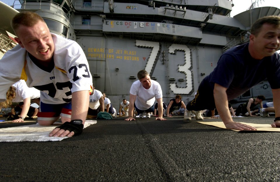 US Navy 040327-N-5319A-006 Sailors aboard USS George Washington (CVN 73) take the opportunity to workout on the flight deck during a no-fly day while operating in the Arabian Gulf