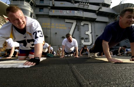 US Navy 040327-N-5319A-006 Sailors aboard USS George Washington (CVN 73) take the opportunity to workout on the flight deck during a no-fly day while operating in the Arabian Gulf photo
