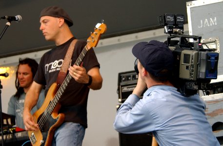 US Navy 040615-N-7217H-062 Journalist Allaman Smith assigned to the Naval Media Center Sasebo, records rock group Dishwalla's bass player, Scot Alexander