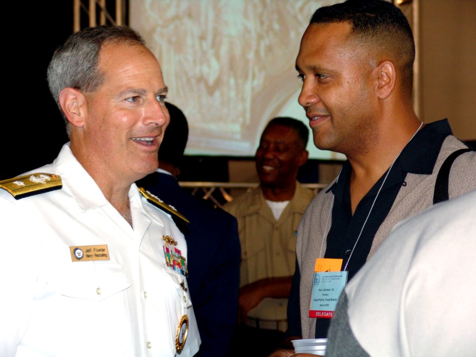 US Navy 040713-N-4729H-014 Rear Admiral Jeffrey Fowler, Commander, Navy Recruiting Command, talks to a delegate at the National Association for the Advancement of Colored People (NAACP) convention in Philadelphia, Pa
